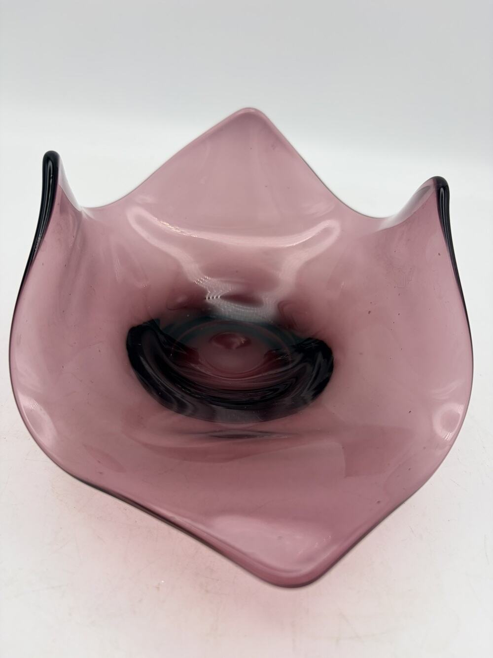 This is a vintage Viking Glass amethyst handkerchief bowl.